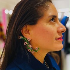 This beautiful intricate flower creeper is sure to make heads turn. Pink and blue flowers sit on the green creeper. Its held by the stud as well as an ear cuff and can be worn in more than one way! 🌸 〰️〰️〰️ 🌸 〰️〰️〰️ 🌸 Care and CompositionMaterial: Zirconia, Brass, Gold. Store in a cloth bag or an airtight box. Keep away from water and alcohol based products like Perfumes, Deodorants etc. Note: Since this product is handcrafted, it might have slight irregularities which only add to its beauty. Unique Flower Earrings For Parties, Green Flower Decoration Jewelry For Party, Pink And Blue Flowers, Brass Gold, Creepers, Independent Designers Fashion, Cloth Bags, Gold Plating, Blue Flowers