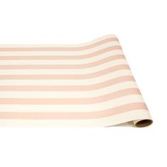 a pink and white striped mat on a white background with a roll of paper in the middle