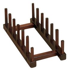 a wooden rack with eight pegs on each side and one in the middle for storing items