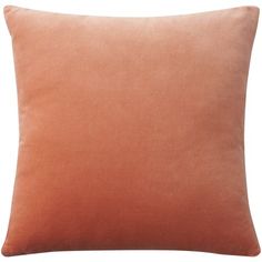 an orange pillow on a white background