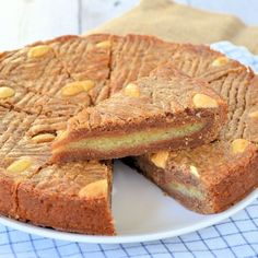 two pieces of cake sitting on top of a white plate