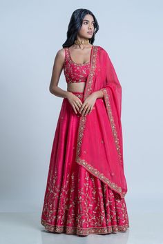 Pink raw silk floral embroidered lehenga with attached cancan. Paired with scoop neck padded blouse and dupatta.
Component: 3
Pattern: Embroidery
Type Of Work: Floral
Neckline: Scoop
Sleeve Type: Sleeveless
Fabric: Blouse and Lehenga: Raw Silk; Dupatta: Organza
Color: Pink
Other Details: 
Lehenga Length: 42 inches
Embroidered border dupatta
Tassel tie-up detailing
Note: The neckpiece worn by the model is not for sale
Occasion: Bride,Wedding - Aza Fashions Organza Embroidery, Pink Floral Blouse, Padded Blouse, Embroidered Lehenga, Embroidered Border, Embroidery Floral, Pattern Embroidery, Silk Dupatta, Floral Bridal