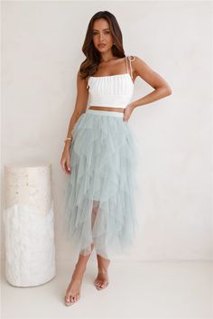 Length from waist to hem of size S: 82cm. Midi skirt. Semi-lined. Model is a standard XS and is wearing size S. True to size. Stretch lining. Tulle design. Elastic waistband. Slip-on. Cold hand wash only. Polyester. Made for all our fun-loving girlies! The Twirl This Way Tulle Midi Skirt features a gorgeous tulle design with an elastic waistband. Style with a top and heels for all the love on your 'fit. Sequin Crop Top And Tulle Skirt, Tutu Skirt Bridesmaid, Tulle Skirt Off Shoulder Top, Tulle Skirt With Feather Top, Shoes For Tulle Skirt, Coral Mini Dress, Tulle Midi Skirt, Long Bodycon Dress, Satin Midi Dress