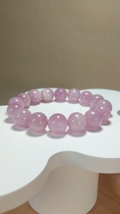 - Genuine Lavender Kunzite bracelet - 12.5+mm beads - All natural queen of quart Kunzite, made without artificial enhancements. You are purchasing the exact bracelet you see from the pictures of this listing (not randomly selected from a lot). - Size: 17+cm (circumference) - PomPom's Jewelry takes pride in using premium elastic strings sourced from Japan for all our beaded bracelets. This choice ensures both exceptional comfort and long-lasting durability. - ** It's natural for stone bead bracel Kunzite Bracelet, Pastel Lavender, Bead Bracelets, Lavender Purple, Stone Beads, All Natural, Etsy Accessories, Jewelry Bracelets, Accessory Gift