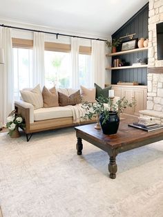 a living room filled with furniture and a fire place in front of a tv mounted on a wall