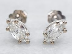 These marquise-cut diamond stud earrings have classic post-back findings that keep them secure and comfortable when worn. The diamonds themselves are full of fire and sparkle with excellent clarity. Crafted of 14-karat white gold, these earrings are a wardrobe staple! Metal: 14K White GoldGem: 2 Diamonds totaling .88 Carats, VS in Clarity, I in ColorGem Measurements: 4.0 x 7.5 mm, Marquise Cut Earrings White Gold, White Gold Diamond Earrings, April Birthstone, Marquise Cut Diamond, Gold Stud Earrings, Gold Diamond Earrings, Colored Gems, Diamond Stud Earrings, Earrings White