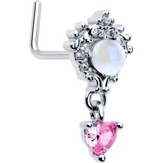 a pair of earrings with pink and white stones on the bottom, hanging from a hook