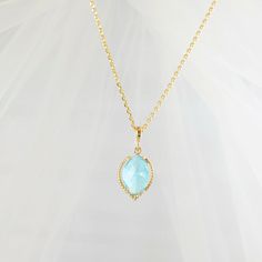 "This gold aquamarine necklace is made with a 10x14mm aquamarine blue, faceted glass, marquise-shaped crystal set in an elegant matte gold bezel, which dangles from a gold bail on a gold cable chain with a lobster clasp. This adjustable necklace has a 2-inch extender and can be worn from 17 to 19 inches. Thank you for looking. NOTE: This listing is for one necklace with one pendant, but you can choose to purchase just the pendant without the chain (see the drop down menu). The \"Pendant - No Cha Blue Aquamarine Pendant Necklace, Light Blue Aquamarine Pendant Necklace, Light Blue Pendant Necklace For Anniversary, Blue Faceted Necklaces For Anniversary, Blue Drop Necklaces With Blue Topaz, Blue Topaz Drop Necklaces, Aquamarine Gemstone Necklace For Wedding, Blue Faceted Drop Necklaces, Blue Faceted Drop Necklace