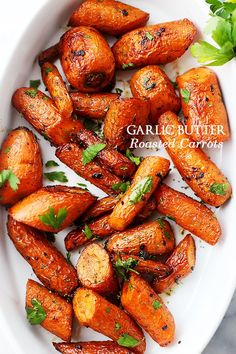 grilled carrots with herbs in a white bowl