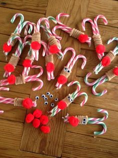 some candy canes and christmas decorations on a wooden floor