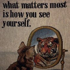 a tiger looking at itself in a mirror with the caption what matters most is how you see your self