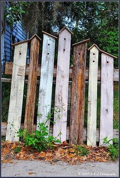 an old fence made out of wooden boards