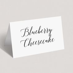 a card with the words blueberry cheesecake written on it in cursive writing