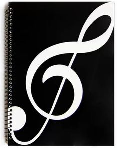 a spiral notebook with a musical note on the front and back cover in white ink