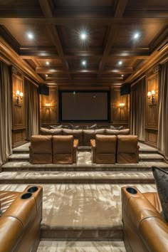 a home theater with leather couches and recliners