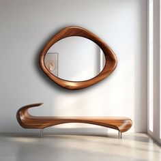 a wooden bench sitting next to a round mirror on the side of a white wall