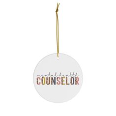 a round ornament with the words countselor hanging from a gold string