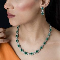 Emerald Doublet Necklace High End Jewelry adds Premium Quality greenstone and shiny cubic zirconia. Perfect for wedding jewelry or any special occasions. This green Paraiba tourmaline necklace surely add a touch of premium ness in your look. *𝐏𝐑𝐎𝐃𝐔𝐂𝐓 𝐃𝐄𝐓𝐀𝐈𝐋* * 𝐌𝐚𝐭𝐞𝐫𝐢𝐚𝐥: Brass * 𝐏𝐥𝐚𝐭𝐢𝐧𝐠: White Rhodium Plated * 𝐒𝐭𝐨𝐧𝐞: AAA-quality CZ Diamond & Emerald. *𝐃𝐈𝐌𝐄𝐍𝐒𝐈𝐎𝐍𝐒* *𝐍𝐞𝐜𝐤𝐥𝐚𝐜𝐞* * 𝐖𝐞𝐢𝐠𝐡𝐭: 39 gm  * 𝐋𝐞𝐧𝐠𝐭𝐡: 17.9 Inches * 𝐖𝐢𝐝𝐭𝐡: 0.5 Inch Round Green Emerald Necklace With Jewels, Green Stone Jewelry For Formal Occasions, Green Formal Jewelry With Stones, Green Stone Formal Jewelry, Emerald Gemstone Jewelry Sets For Anniversary, Formal Bridal Necklace With 17 Jewels And Emerald, Anniversary Emerald Gemstone Jewelry Sets, Anniversary Emerald Necklace With Cubic Zirconia Jewels, Green Jewel Bridal Necklace For Anniversary