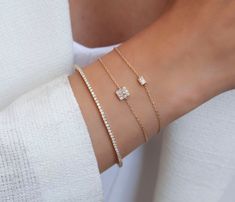 This 14k invisible baguette bracelet has the look of a 2 ct solitaire baguette diamond. Perfect for layering or to gift someone special. __________________________________________M A T E R I A L & L E N G T HAvailable in 14k Yellow Gold, 14k Rose Gold, 14k White GoldCharm Measurements: 5 mm x 5 mm ( 0.2 inch x 0.2 inch)Stone: Round and Baguette Natural DiamondsDiamonds: .25 ct twBracelet length: 6+1 inches (Let us know if you prefer a different length) Closure: Lobster ClaspChain: Cable chainCol Timeless Luxury Bracelet With Single Diamond, Baguette Bracelet Diamond, Rectangular Diamond Bracelet With Baguette Diamonds For Gift, Gift Rectangular Diamond Bracelet With Baguette Diamonds, Gift Baguette Diamond Bracelet With Rectangular Shape, Gift Rectangular Baguette Diamond Bracelet, Timeless Diamond Bracelet With Baguette Diamonds As Gift, Timeless Diamond Bracelet With Baguette Diamonds, Modern Diamond Bracelet With Baguette Diamonds As Gift