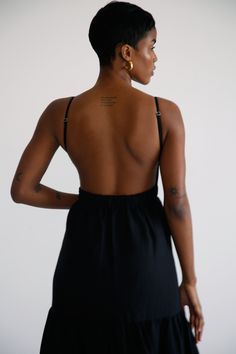 The Celine Low Back dress combines elegance and comfort. Made from a linen blend, this dress features a layered floor-length skirt and a captivating open back. Celine Dress, Low Back Dress, Low Back Dresses, Floor Length Skirt, Black Xs, Back Dress, Signature Collection, Dress Trousers, Low Back