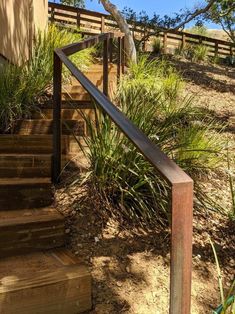 the stairs lead up to the beach from the house, which is located on top of a hill