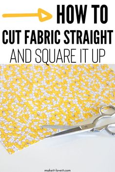 a pair of scissors sitting on top of a piece of fabric with the words how to cut fabric straight and square it up