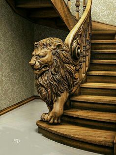 a lion statue sitting on top of a wooden stair case next to a banister