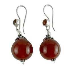 Believed to mirror the sun's energy carnelian the birthstone of July glows with fiery beauty in earrings by Narayani. Sterling silver settings reflect Indian elegance in earrings that are crafted by hand in India. .925 Sterling silver Round Dangle Earrings, Earrings Handmade Dangle, Cultured Pearl Necklace, Beaded Earrings Patterns, Sterling Silver Dangle Earrings, Pearl Earrings Dangle, Earring Patterns, Beaded Stretch Bracelet, Silver Earrings Dangle