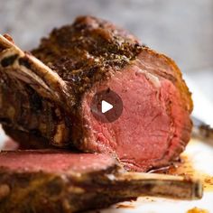 a piece of meat sitting on top of a white plate