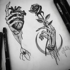 two roses and the letter f are drawn on paper