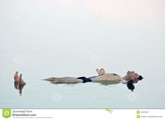 a woman floating on her back in the water