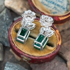 These beautiful earrings each feature an emerald cut emerald in a four split prong setting. The emeralds are topped by three (3) marquise brilliant cut diamonds in two-prong settings. The earrings measure 14.9mm long by 8.4mm wide and 5.7mm deep, finished with posts and friction backs for pierced ears. Emerald Diamond Earrings For Formal Occasions, Green Emerald Cut Diamond Earrings For Formal Occasions, Green Emerald Cut Diamond Earrings For Formal Events, Emerald Cut Green Diamond Earrings For Formal Events, Formal Green Emerald Cut Diamond Earrings, Emerald Diamond Earrings For Formal Events, Formal Fine Jewelry Emerald Cut Diamond Earrings, Elegant Green Emerald Cut Diamond Earrings, Elegant Green Emerald-cut Diamond Earrings