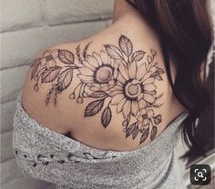 a woman with a sunflower tattoo on her shoulder