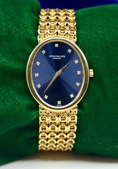 Brand: Patek Philippe Movement: hand-winding Case Material: 18K Yellow Gold Case Size: 30*35 mm Thickness: 6 mm Bracelet: 18K Yellow Gold Wrist size: Approximately 7.5 inch Dial: Blue color with Gold color hands and Hour Marks-Diamonds  Weight of the watch: 95.2 GM   Additional services such as refinishing and appraisal will be at extra cost ! We guarantee that all of our items are 100% authentic ! For additional photos and any inquiries, please send us a Direct Message ! We are official wholesalers, who have been selling for more than 2 decades ! Eligible for Paypal Credit & Affirm, If you're interested, please check if you qualify. For any questions, please feel free to send us a message. Luxury Gold Oval Watch, Luxury Oval Gold Watches, Gold Oval Watch With Diamond Hour Markers, Gold Oval Watches With Diamond Hour Markers, Oval Diamond Watch For Formal Occasions, Formal Oval Diamond Watch, Formal Oval Diamond Watch With Diamond Hour Markers, Luxury Diamond Hallmarked Watch, Oval Watches With Diamond Hour Markers For Anniversary