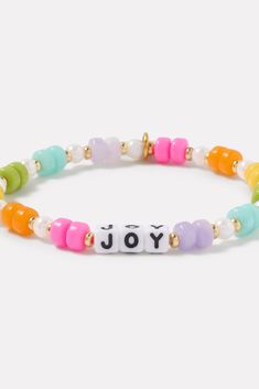 A wearable reminder of words to live by, this beaded bracelet by Little Words Project is handcrafted with “Joy” lettering, multi-color beads, and stretch elastic for easy on-and-off. Alone or stacked, it makes the perfect gift for yourself or a friend. Little Words Project encourages you to wear your word to lift you up, and then pass it on to someone who needs it more. Each bracelet comes with a unique ID tag. Use this code to register your bracelet on the Little Words Project website to join the community and track your bracelet’s journey from person to person. | LITTLE WORDS PROJECT Women's Joy Bracelet, Size Medium/Large, White Adjustable Multicolor Inspirational Stretch Bracelet, Inspirational Adjustable Multicolor Stretch Bracelet, Adjustable Inspirational Multicolor Stretch Bracelet, Inspirational Multicolor Stretch Bracelet With Round Beads, Inspirational Multicolor Stretch Bracelet As Gift, Inspirational Multicolor Beaded Bracelets With Round Beads, Inspirational Multicolor Adjustable Stretch Bracelet, Inspirational Multicolor Stretch Bracelet Gift, Inspirational Multicolor Beaded Bracelet With Round Beads