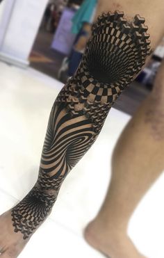 a man's arm and leg with an intricate design on the inside of it