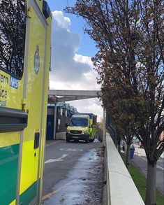 an ambulance is parked on the side of the road