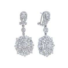 Take your style to new heights with the Alouette Diamond Drop Earrings. These opulent 18 karat gold earrings feature baguette cut and round brilliant diamonds totaling 3 1/6 carats, making them a statement of luxury and elegance. Elevate any outfit and turn heads with these stunning earrings. Diamond Earrings Dangling, Diamond Chandelier Earrings, Diamond Chandelier, Expensive Jewelry Luxury, Gold Rings Fashion, Luxury Earrings, Diamond Dangle Earrings, Rings Fashion, Jewelry Luxury