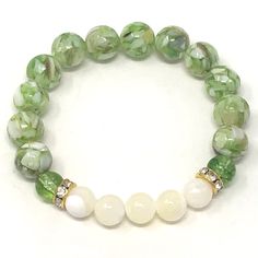 Precious looking green peridot & mother of pearl gemstones bracelets • elegant, simple and meaningful! Known as the stone of compassion, peridot is believed to bring good health, restful sleep and peace to relationships by balancing emotions and mind. Mother of Pearl offers protection, brings the gentle healing power of the sea. It is a stress relieving stone; relaxing, soothing and calming to the emotions. The 2 piece set includes: 1x 8mm green peridot with natural shell bracelet 1x 8mm mot Gemstones Bracelets, Bracelets Elegant, Balancing Emotions, Green Beaded Bracelets, Healing Gemstone Bracelets, Fusion Beads, Green Bracelet, Wrist Candy, Green Pearls