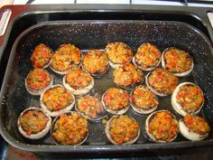 a pan filled with lots of cooked food on top of a stove