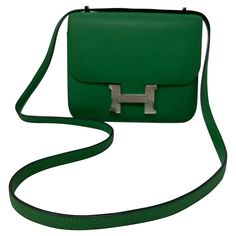 Hermes Green Constance 18 Bag. Palladium silver hardware. Box smooth leather. Rare color and size. Interior clean. Great investment bag. Includes dust bag and box. Guaranteed authentic. Designer Tan Box Bag For Formal Occasions, Luxury Tan Box Bag For Formal Occasion, Classic Rectangular Box Bag With Palladium Hardware, Classic Green Shoulder Bag With Silver-tone Hardware, Designer Rectangular Box Bag With Silver-tone Hardware, Luxury Rectangular Box Bag With Silver-tone Hardware, Elegant Green Box Bag With Original Box, Luxury Box Bag With Silver-tone Hardware For Formal Occasions, Green Shoulder Bag With Palladium Hardware For Office