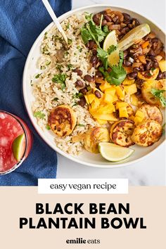 a bowl filled with black bean and rice next to a drink