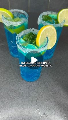 two glasses filled with blue lagoon mojito