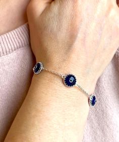 "Sterling Silver Dark Blue Evil Eye Bracelet for Women and Girls 10 mm Transparent Dark Blue Murano Glass Eyes Available Assorted Colors... Sterling Silver / Gold Plated Sterling Silver Handcrafted, Dark Blue Murano Glass Evil Eye Bracelet. Made with a strong, durable Rolo chain.   When a person wears an evil eye with them, it guards against misfortune happening in one's life. 7.00\" length and 2.00\" extender. The total length is 9.00\"  10 mm translucent Murano glass beads. 9 different color options for your style Exquisite workmanship, best quality product, wide range color option. Comes with a free gift box" Blue Evil Eye Bracelet, Evil Eye Design, Good Luck Bracelet, Silver Link Bracelet, Wrist Bracelet, Silver Chain Style, Murano Glass Beads, Protection Bracelet, Bad Luck