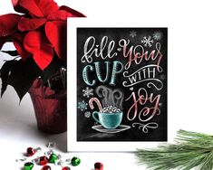 a christmas card with the words fill your cup with joy next to candy and poinsettis