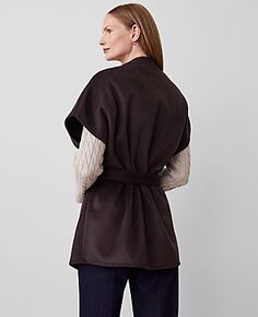 Wrap yourself in the elegance of autumn with the Ann Taylor Cap Sleeve Belted Poncho. This chic poncho is a must-have for your wardrobe, blending functionality with style.

- **Size:** XS/S
- **Color:** Chocolate
- **Material:** 67% Polyester, 25% Viscose, 8% Wool
- **Gender:** Female
- **Features:** Open front, cap sleeves, self-tie belt
- **Dimensions:** 28 1/2" x 33 1/2"
- **Care:** Machine washable

Designed for the modern woman, this poncho from Ann Taylor offers a sophisticated way to stay Chic Fall Wrap Poncho, Chic Brown Cape For Fall, Fall Wrap-style Belted Outerwear, Fall Belted Wrap Outerwear, Belted Wrap Outerwear For Fall, Poncho Outfit, Female Features, Female Design, Ladies Poncho