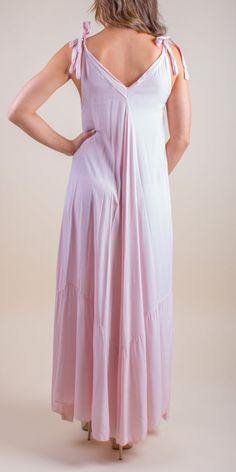 Double V-Neck Maxi Dress with Adjustable Ties at the Shoulders. 100% Viscose One Size Fits Most Made in Italy Model is 5'8" V-neck Viscose Dresses For Loungewear, Pink V-neck Maxi Dress For Loungewear, Stretch V-neck Loungewear Dress, Solid V-neck Viscose Maxi Dress, Summer Solid Color Viscose Maxi Dress, Solid Viscose Maxi Dress For Summer, Flowy Viscose Dresses For Loungewear, Sleeveless Rayon Loungewear Dress, Sleeveless Rayon Dress For Loungewear