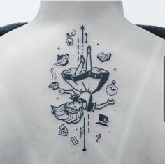 the back of a woman's neck with tattoos on it