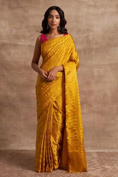 Mustard handloom saree with geometrical patterns, intricate Tanchoi weave and fringe border.
Components:1

Fabric:Base Fabric Pure Silk
Color:Yellow
Tanchoi crafted
Note: Blouse worn by the model is not for sale - Aza Fashions Mustard Saree, Saree Yellow, Cotton Sarees Handloom, Yellow Saree, Saree For Women, Yellow Silk, Banarasi Silk Saree, Lehenga Saree, Indian Fashion Designers