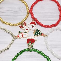 "5 Christmas charm bracelet a nice gift for your loved ones or even for yourself. Details: ❤ Materials of the bracelets: ✮ Beads: 4mm red, green, white, gold, silver beaders. ✮ Charm: Santa, snowman, bells, deer, tree enamel charms ✮ Made on strong stretchy elastic. ❤ Size: 4 - 5 years - 6\" 6 - 7 years - 6,5\" 8 - 12 years - 7\" S - 7,25\" M - 7,5\" L - 7,75\" XL - 8\" ❤ Bracelet comes in a little gift box ❤ You can personalize this bracelet with a name on it or with a paper card. ❤ We have oth Advent Fillers, Kids Christmas Party Favors, Pumpkin Jewelry, Advent For Kids, Halloween Bracelet, Kids Christmas Party, Stocking Stuffers For Kids, Christmas Party Gift, Kids Holiday